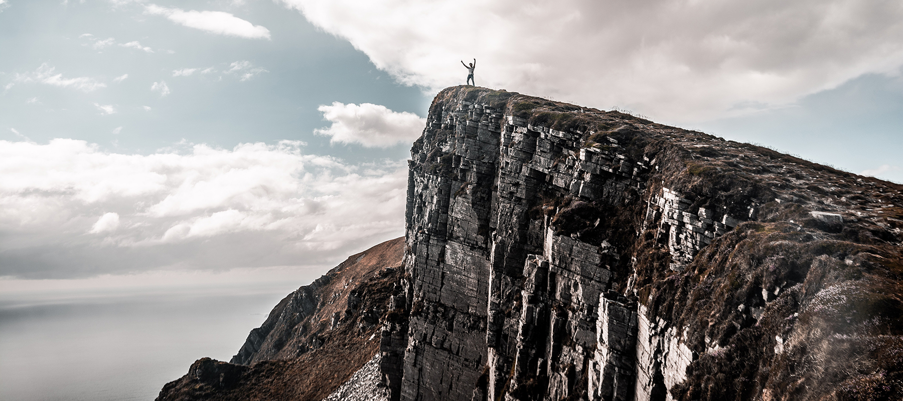 Heroic Fundraising Featured Image_A Person Standing on Top of a Mountain