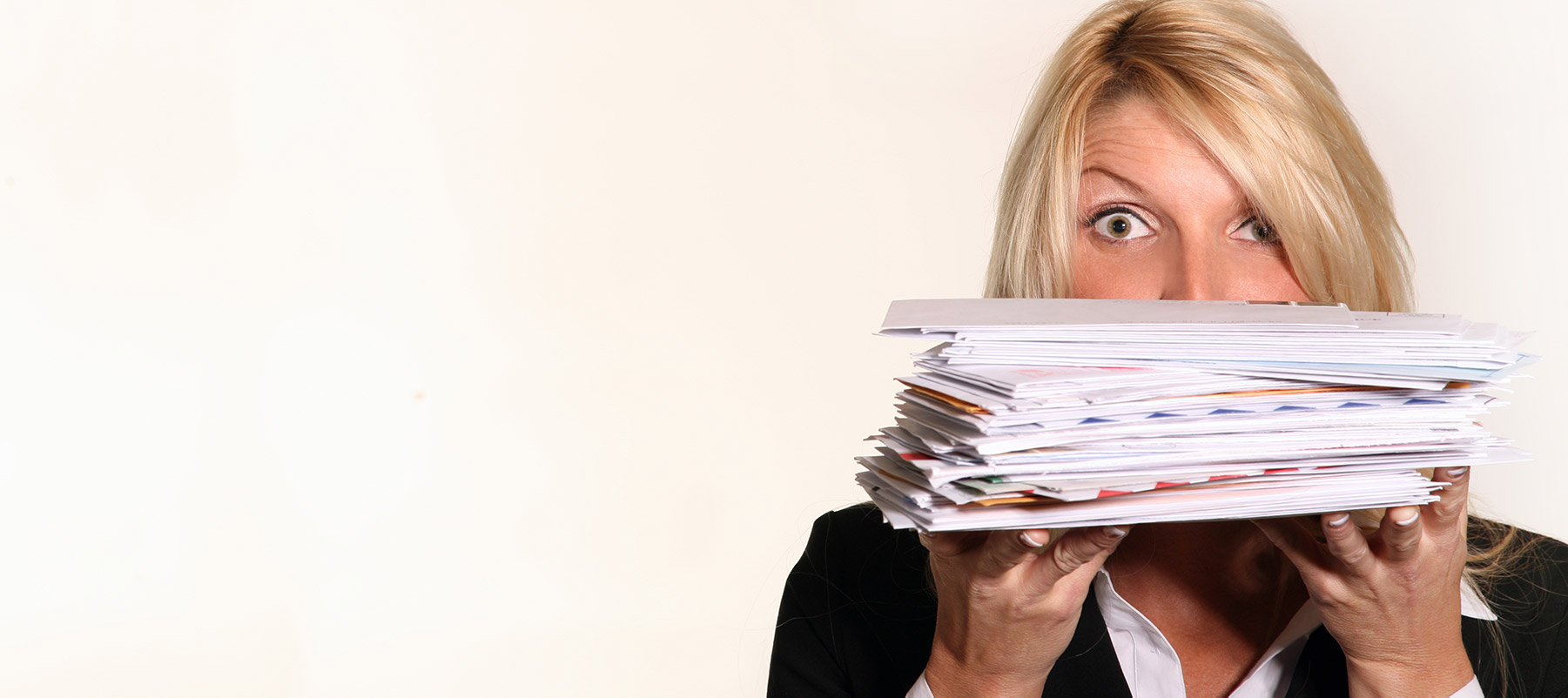 Heroic Fundraising Featured Image_Woman Holding a Large Stack of Mail